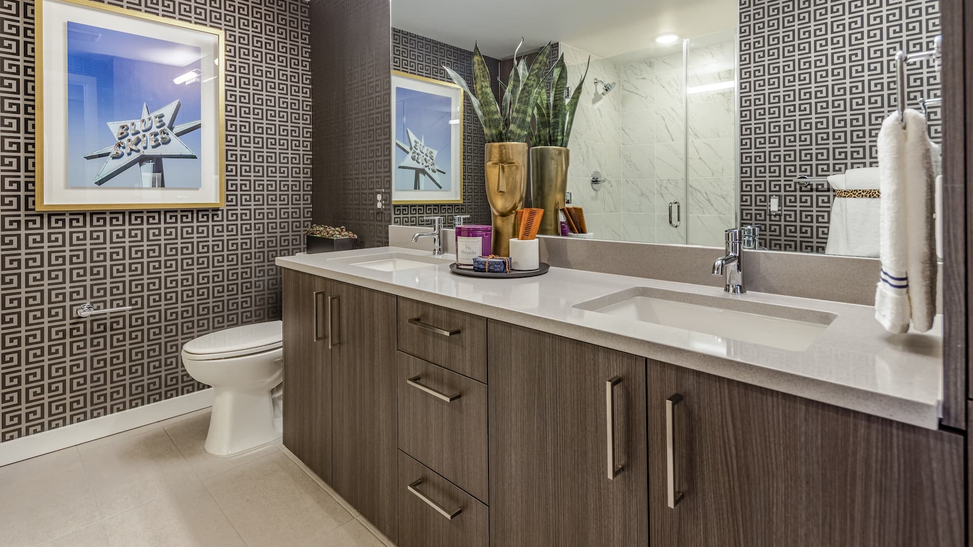 bathroom with ample counter-space and bright lighting